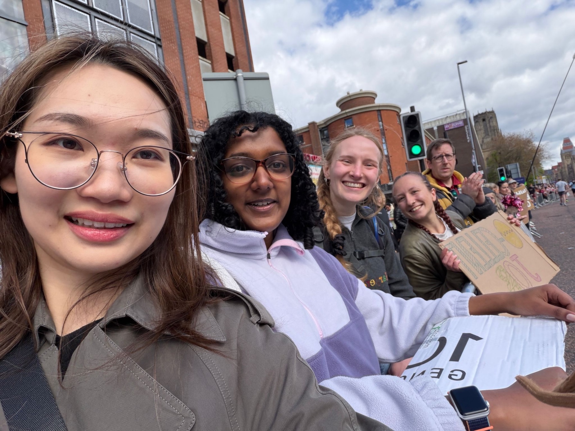 Lab team cheering at the marathon
